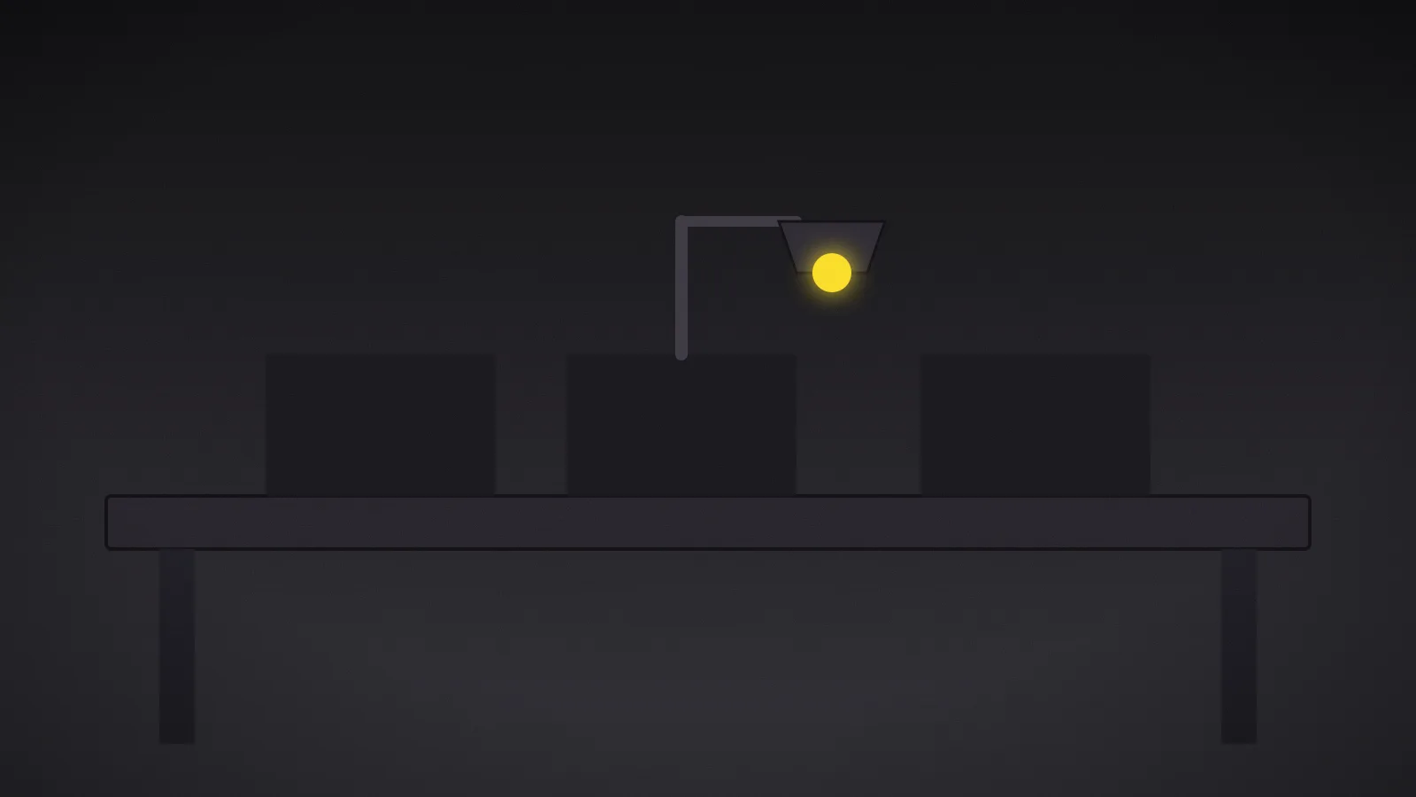 A single amber task lamp glowing above one empty workbench in a row of identical dark workbenches.
